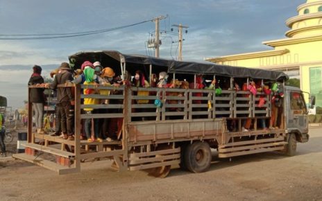Garment factory workers commute on the back of a truck in Kandal province on September 21, 2021. (AIP Foundation)