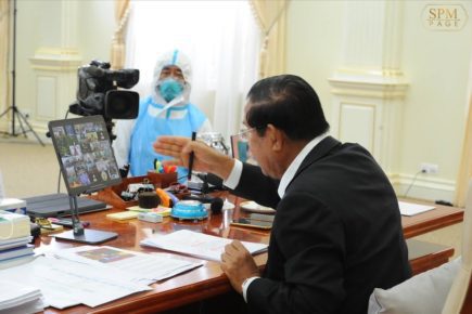 Hun Sen speaks to provincial officials on July 1 ordering the purchase of coffins and herbal remedies while also chastising them over the hoarding of rapid tests in warehouses, in a photo posted to his Facebook page.