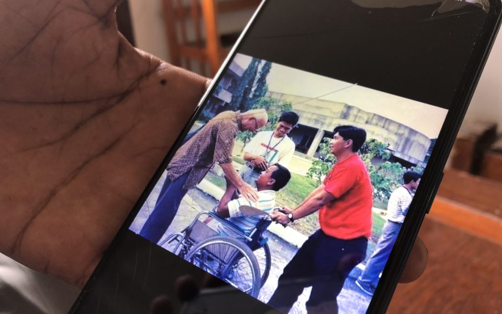 Men Yuth, a former teacher at Banteay Prieb vocational school, shows photos of Brother Richie Fernando on his phone, on September 28, 2021. (Matt Surrusco/VOD)