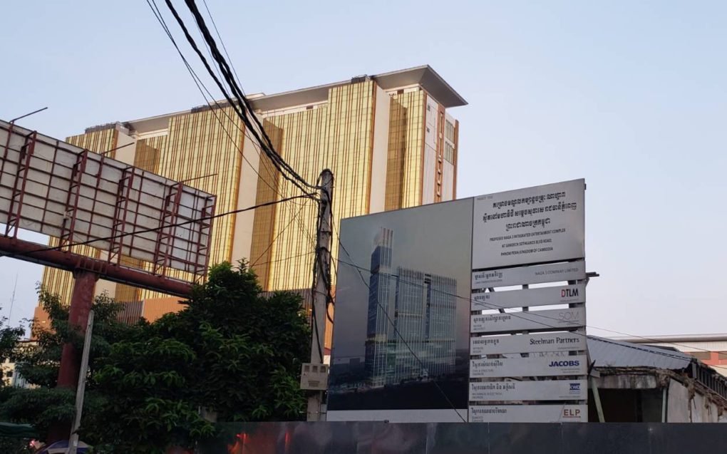 The project sign for the Naga 3 construction, with the Naga 2 building visible in the background, on October 28, 2021. (Danielle Keeton-Olsen/VOD)