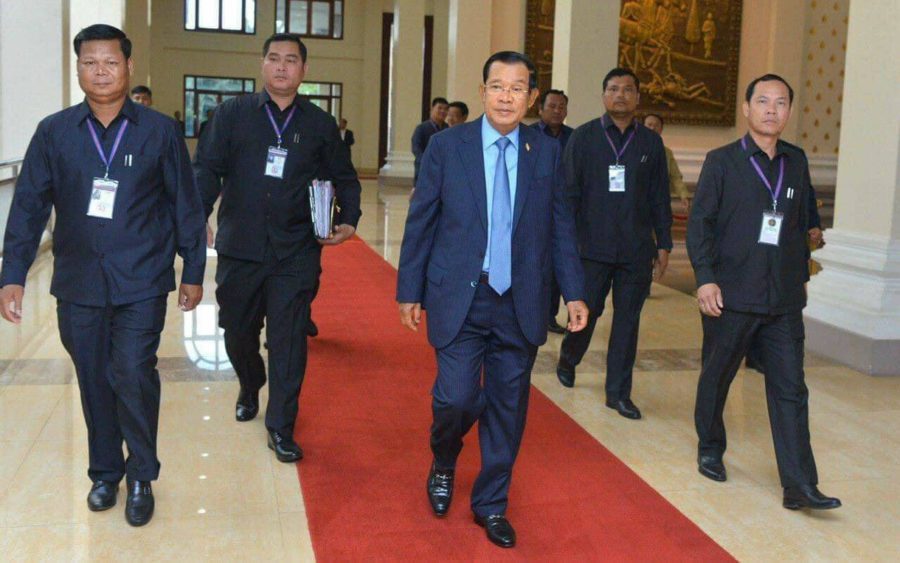 Prime Minister Hun Sen walks with four bodyguards Nam Phiron, Long Da, Khut Sokhon and Orn Sothyrath. (Fresh News)