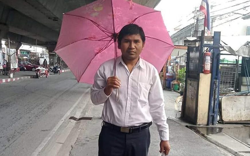Voeun Veasna, an activist with the court-dissolved CNRP opposition, pictured on a street in Thailand. (Photo from the activist's Facebook page)