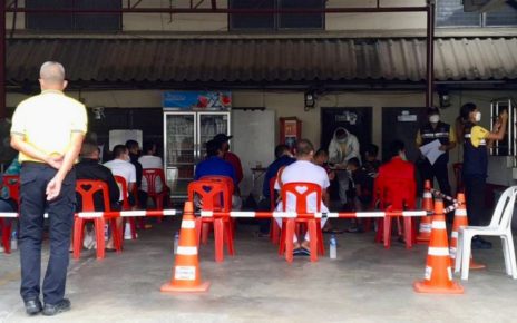 Bor Bet seated at a Thai Immigration Bureau on Thursday morning after being detained Wednesday evening. (Supplied)