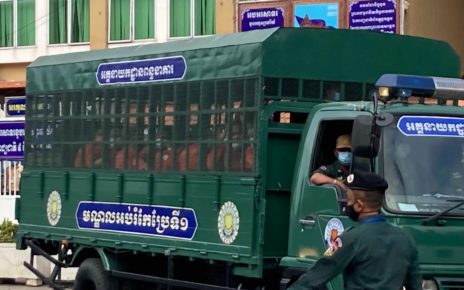 Defendants are brought in prison uniform to the Phnom Penh Municipal Court in an armored truck on December 9, 2021. (Ouch Sony/VOD)