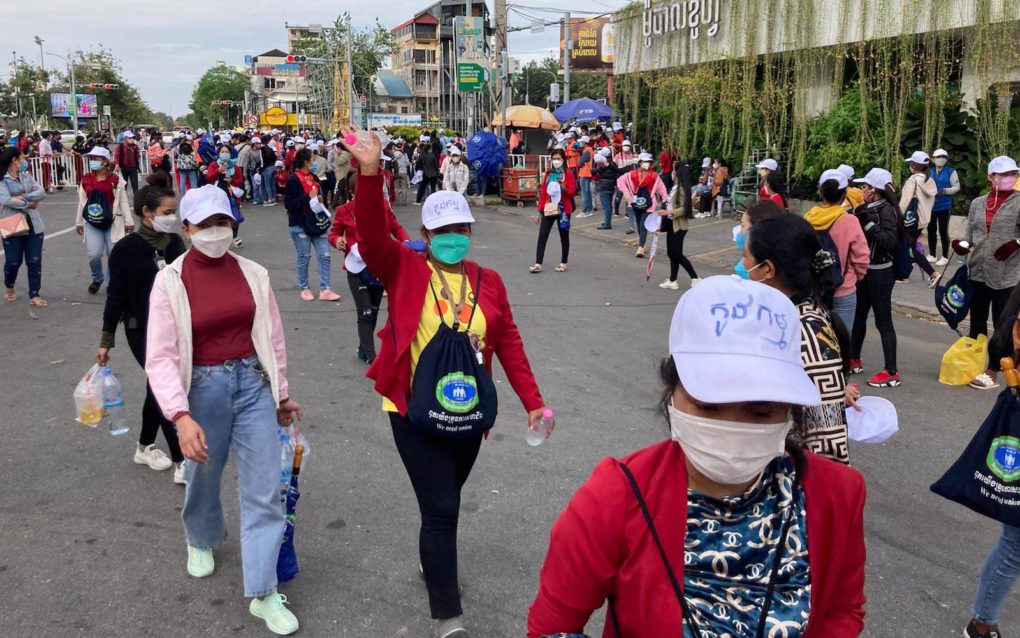 A striker waves goodbye as the Nagaworld strike disburses at 4 p.m. on December 19, 2021. (Ananth Baliga/VOD)