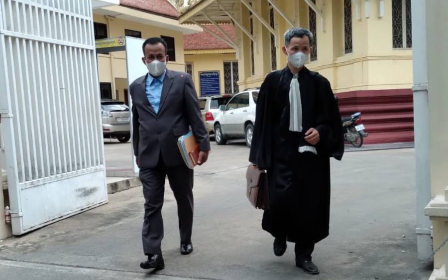 Heart Party founder Seam Pluk and his lawyer Choung Choungy leave the Supreme Court in Phnom Penh on December 24, 2021. (Ouch Sony/VOD)