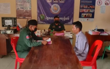Battambang resident Khleng Chhok is questioned by the Thma Kuol district police in a photo posted to their Facebook page on February 8, 2022.