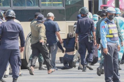 Security officials drag away a NagaWorld strike member during Thursday's detententions. On Friday, unionists did not attempt to gather. (Photo provided by Licadho)