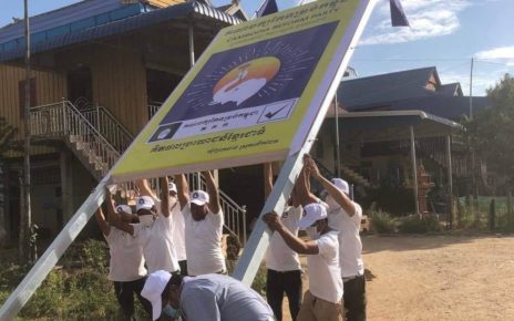 A group of Cambodia Reform Party members raise a sign bearing their party logo on December 20 in Kandal province. (Ou Chanrath's Facebook page)