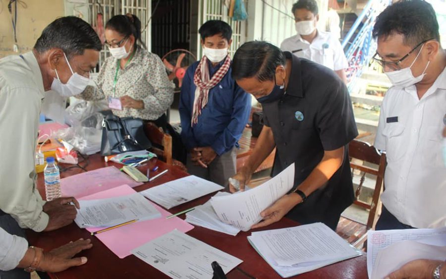 Officials participate in the registration of commune-election candidates. (National Election Committee’s Facebook page)
