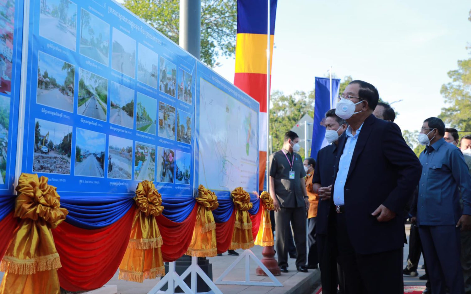 Prime Minister Hun Sen views an infrastructure project poster in Siem Reap province during a speech on April 4, 2022. (Hun Sen's Facebook page)