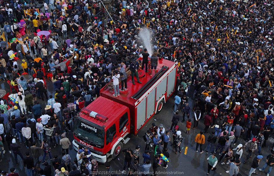 A firetruck sprays a crowd with its water hose during the 2022 Khmer New Year celebration in Battambang province. (Battambang Provincial Administration Facebook page)