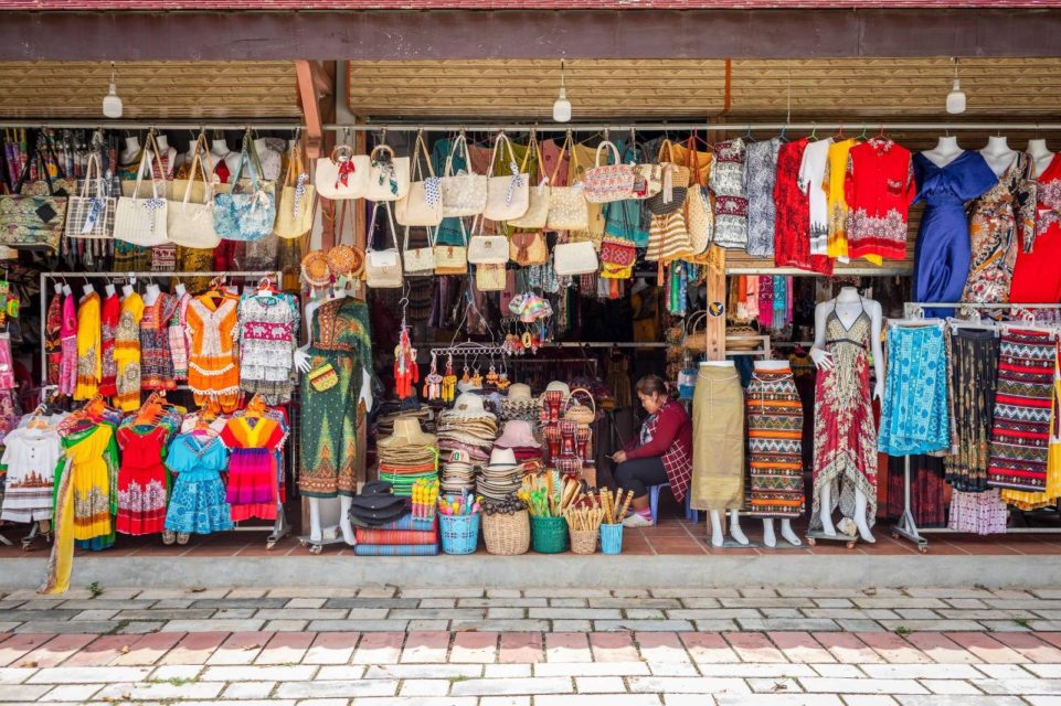 A vendor sits between rows of bags, hats, sarongs and other souvenirs in the new retail center in Angkor Archaeological Park on April 1, 2022. (Roun Ry/VOD)