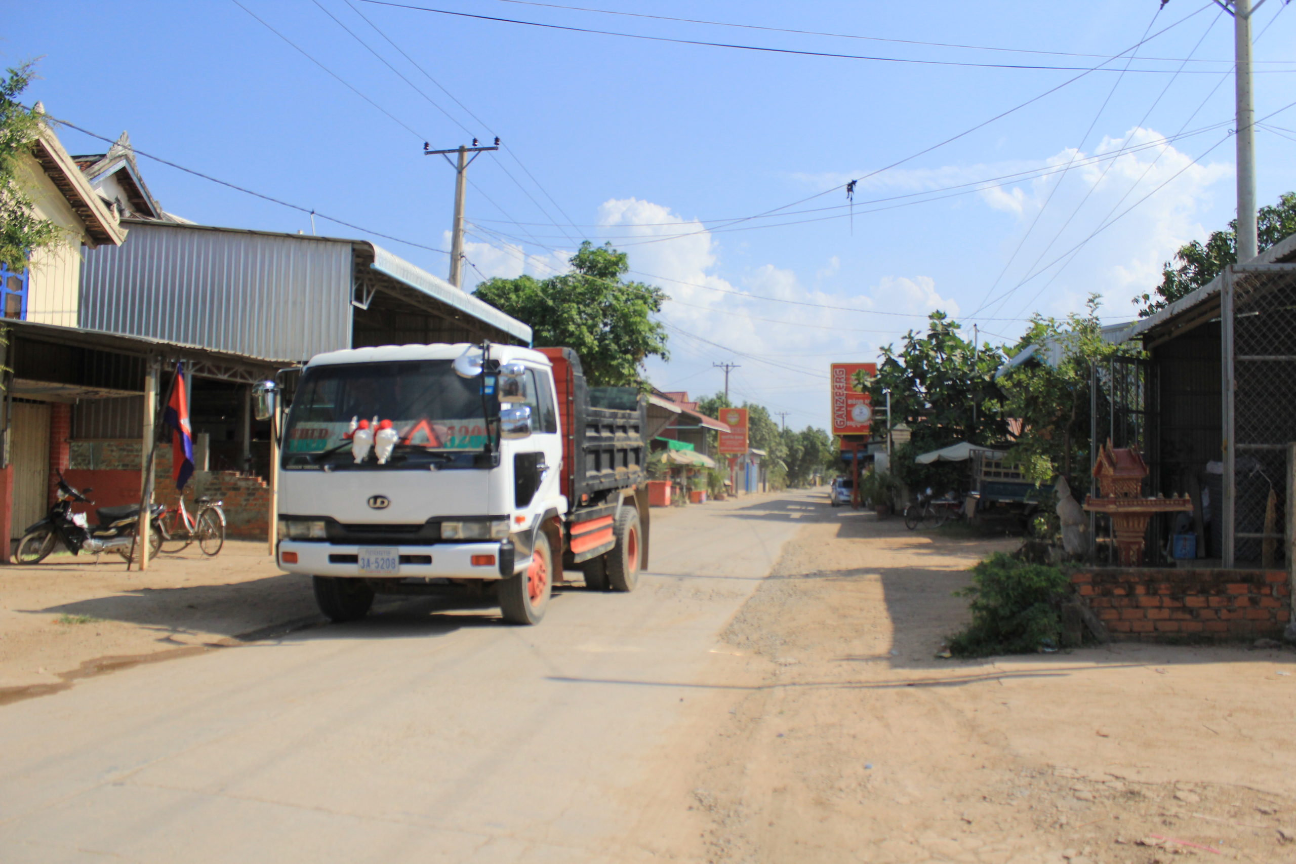 A truck used to haul sand and gravel pulls into a village on Koh Dach on Friday, April 22, 2022. (Andrew Haffner/VOD)