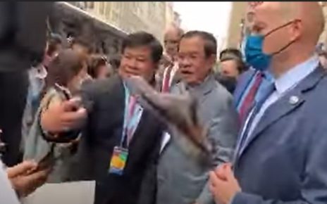 A screenshot from a video of a shoe being thrown toward Prime Minister Hun Sen as he meets a crowd in the U.S. on May 11, 2022.