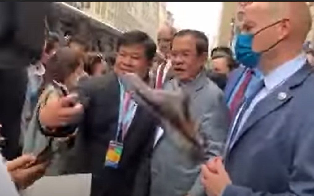 A screenshot from a video of a shoe being thrown toward Prime Minister Hun Sen as he meets a crowd in the U.S. on May 11, 2022.