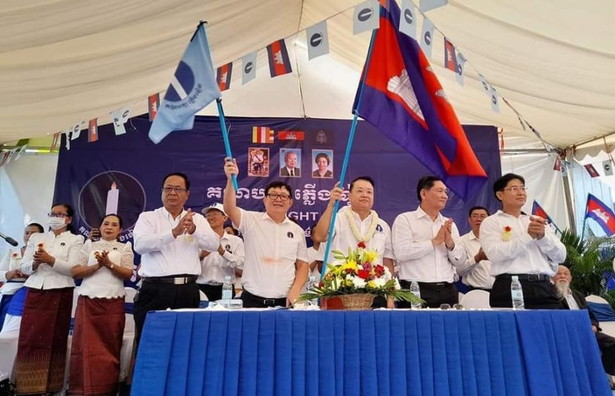 Candlelight Party leaders wave flags amid a party congress in Phnom Penh on May 15, 2022. (Candlelight Party Facebook page)