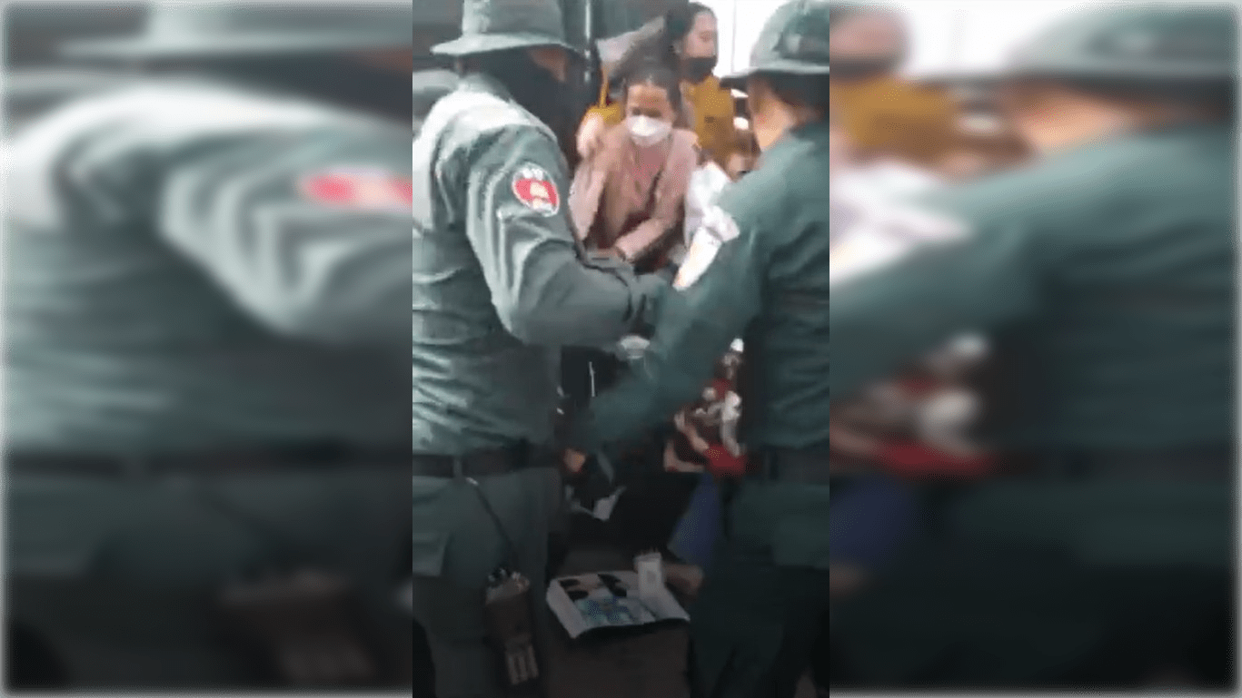 District guards shove NagaWorld workers onto a bus, in a screenshot of a video on May 25, 2022. (Supplied)