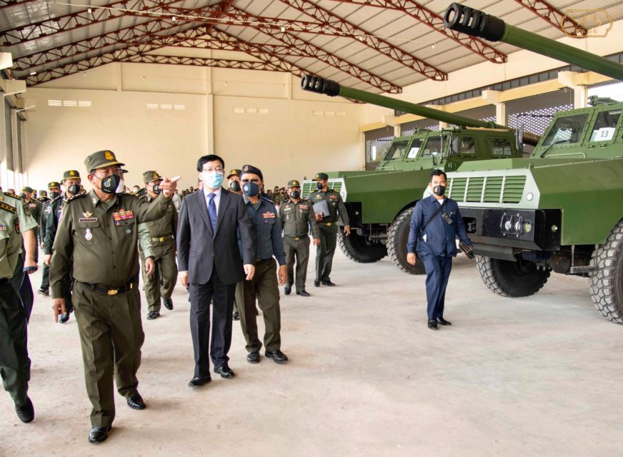 Defense Minister Tea Banh points out new self-propelled SH-1 howitzers acquired by the Royal Cambodian Army to Chinese Ambassador Wang Wentian in a photo posted to Banh's Facebook page on May 28, 2022.