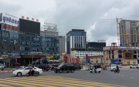 Cars drive past a mall facing the Two Lions Roundabout in Sihanoukville on May 30, 2022. (Danielle Keeton-Olsen/VOD)