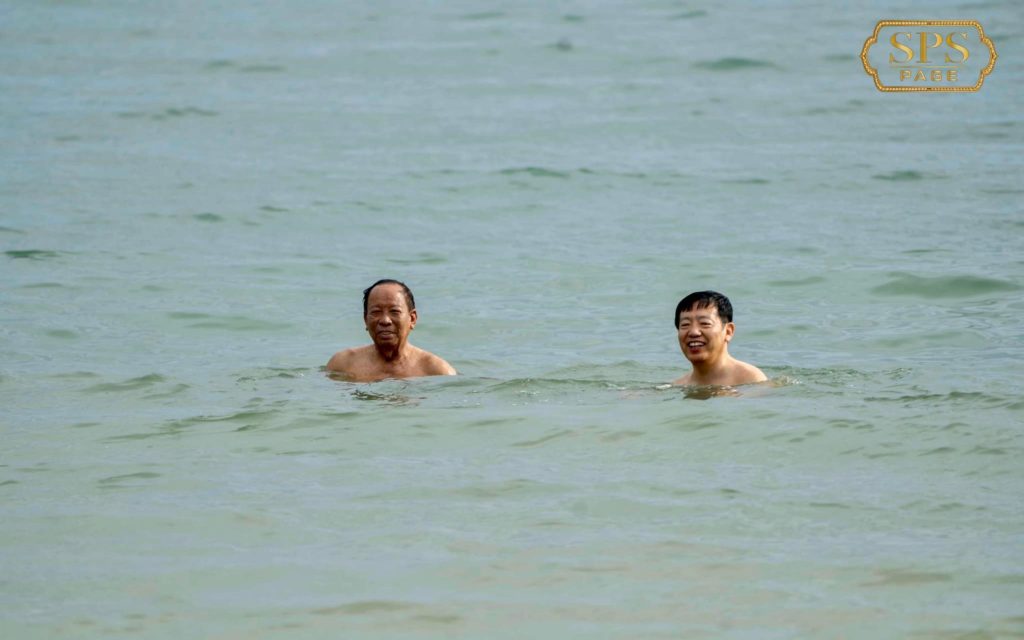 Defense Minister Tea Banh and Chinese Ambassador Wang Wentian swim in the Gulf of Thailand on the Sihanoukville coast in a photo posted to Facebook on June 7, 2022.