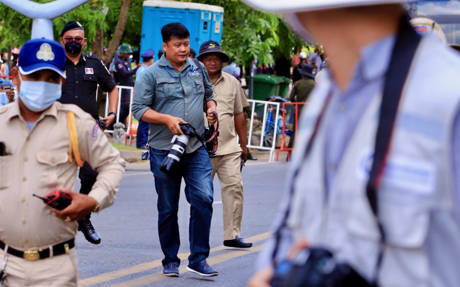 Local officials push back a photojournalist at the NagaWorld protest in Phnom Penh on June 27, 2022. (Hean Rangsey/VOD)
