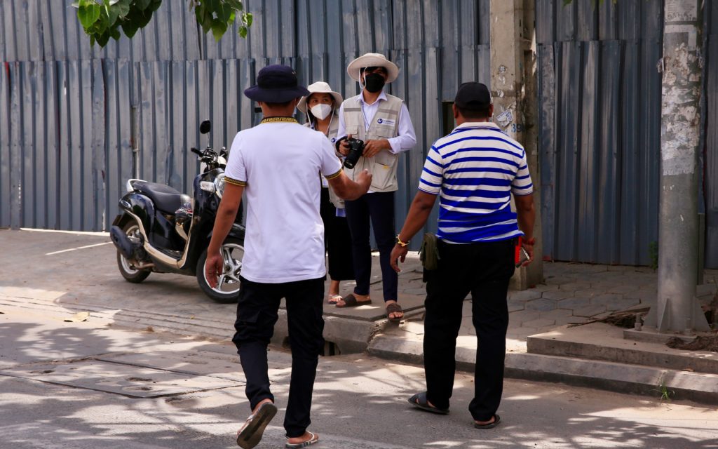 Plainclothes officials prevent CCHR monitors from observing the protest on June 28, 2022.