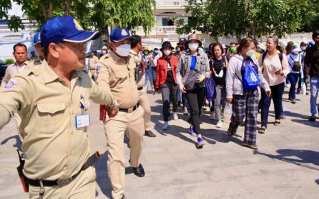 Security officials block NagaWorld workers from walking to the National Assembly on June 20, 2022.