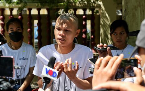 Thun Ratha, with Long Kunthea and Phuon Keoreaksmey next to him, speaks to the media after the hearing at the Supreme Court on July 22, 2022. (Hean Rangsey/VOD)