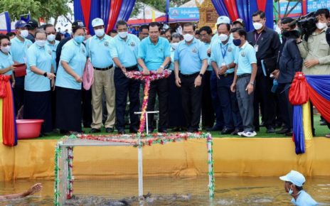Prime Minister Hun Sen releases fish at a Banteay Meanchey reservoir July 1, 2022.