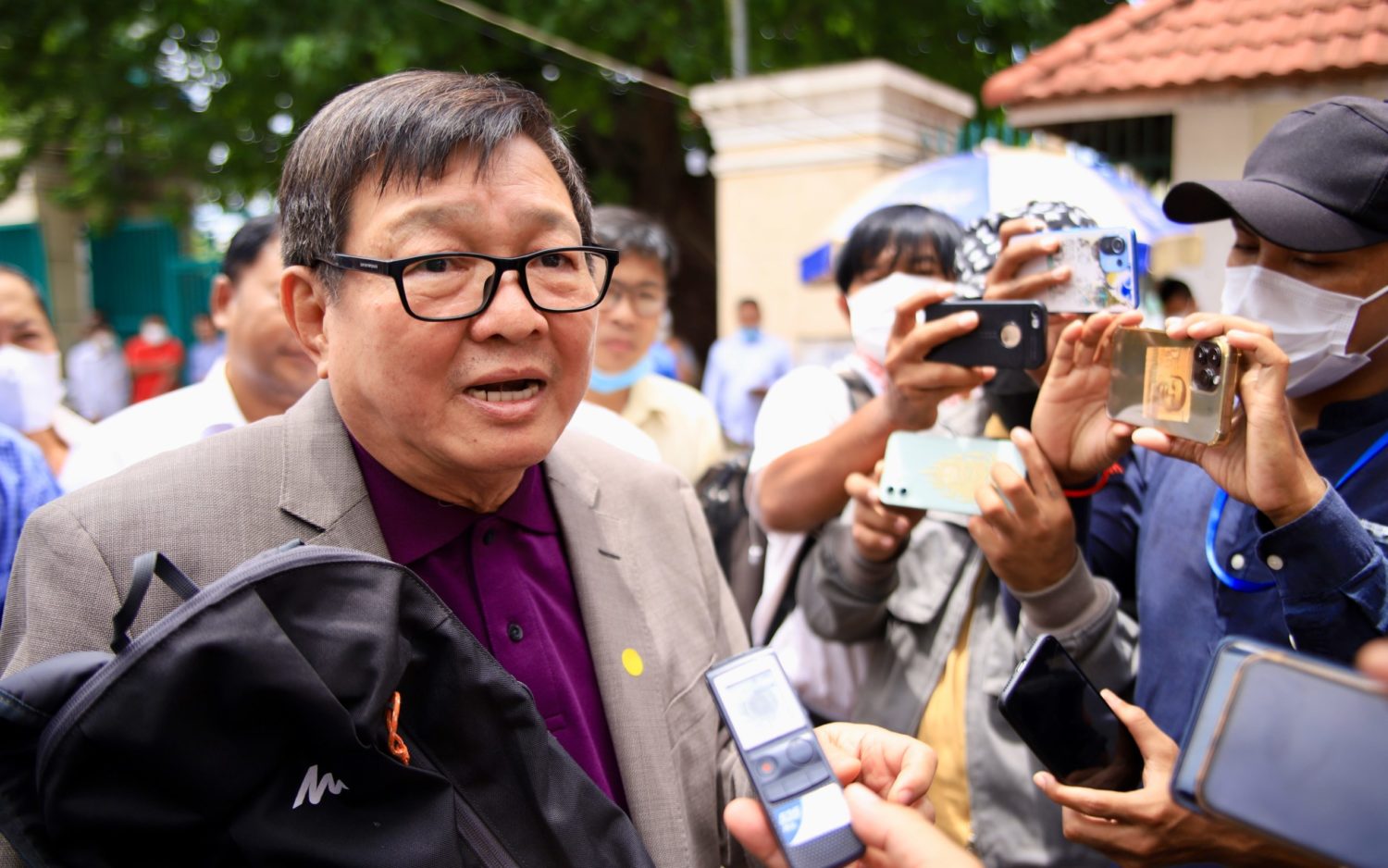 Candlelight vice president Son Chhay speaks to the media on July 15, 2022, after he was questioned in relation to a CPP lawsuit.