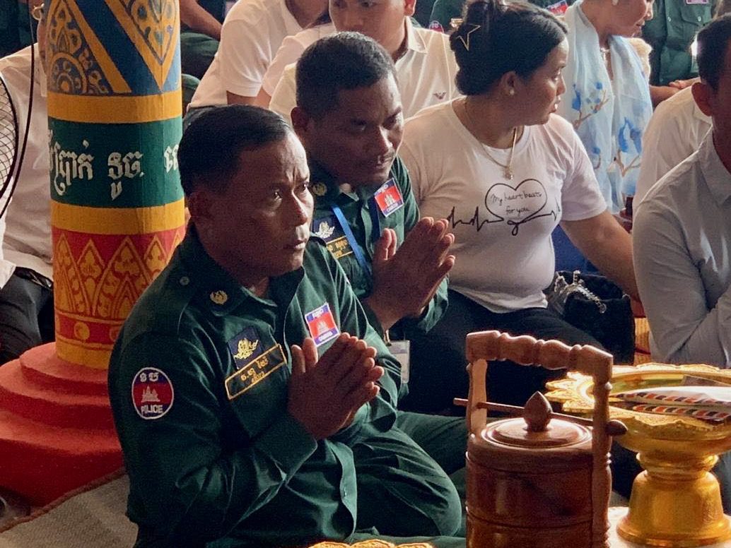 Kampot deputy police chief Hour Yai, left, in a photo posted to the Prey Nob district police's Facebook page in July 2020.