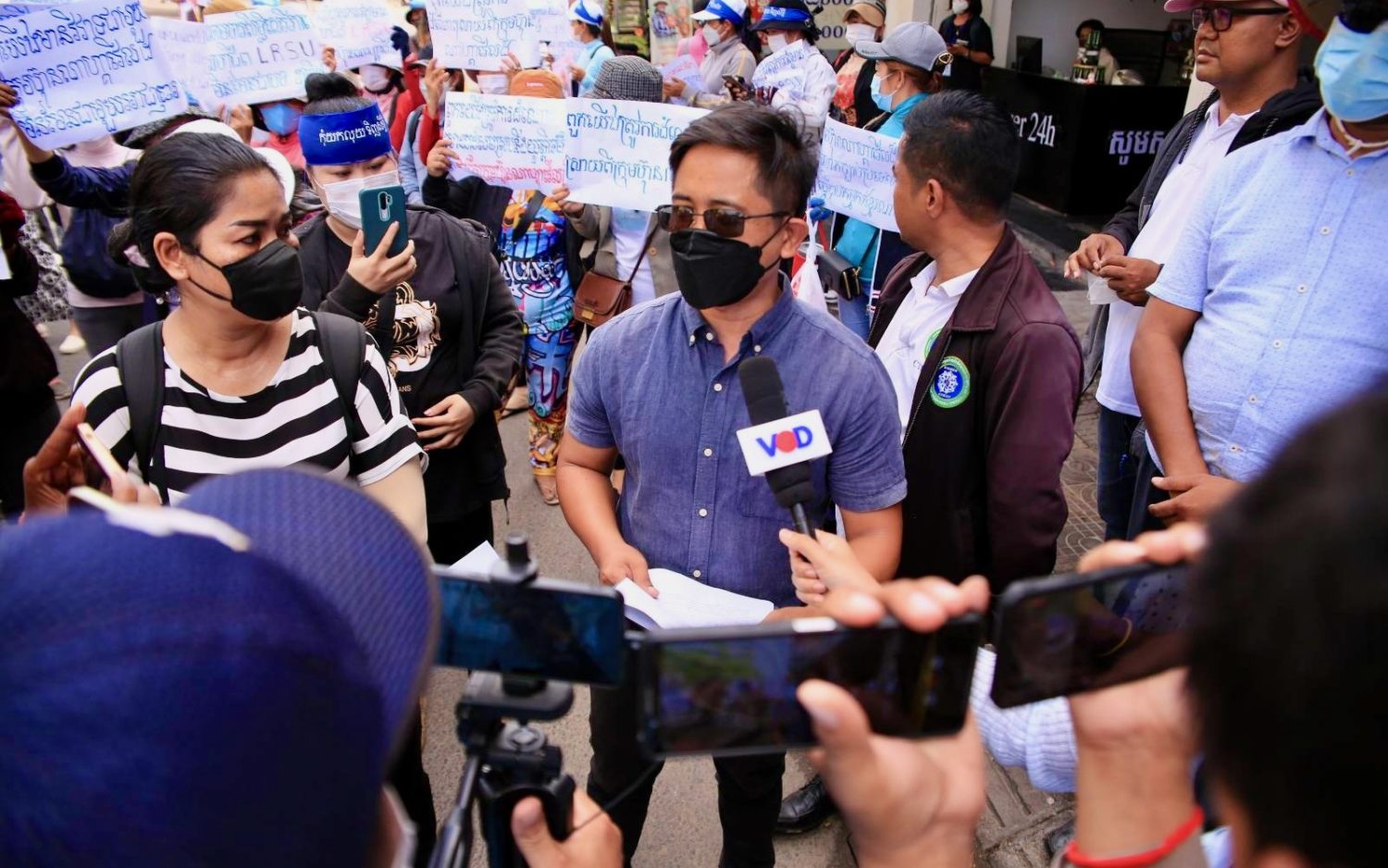 Union leader Yang Sophorn and Central staffer Khun Tharo speak to the media at the NagaWorld workers' protest in Phnom Penh on July 5, 2022.