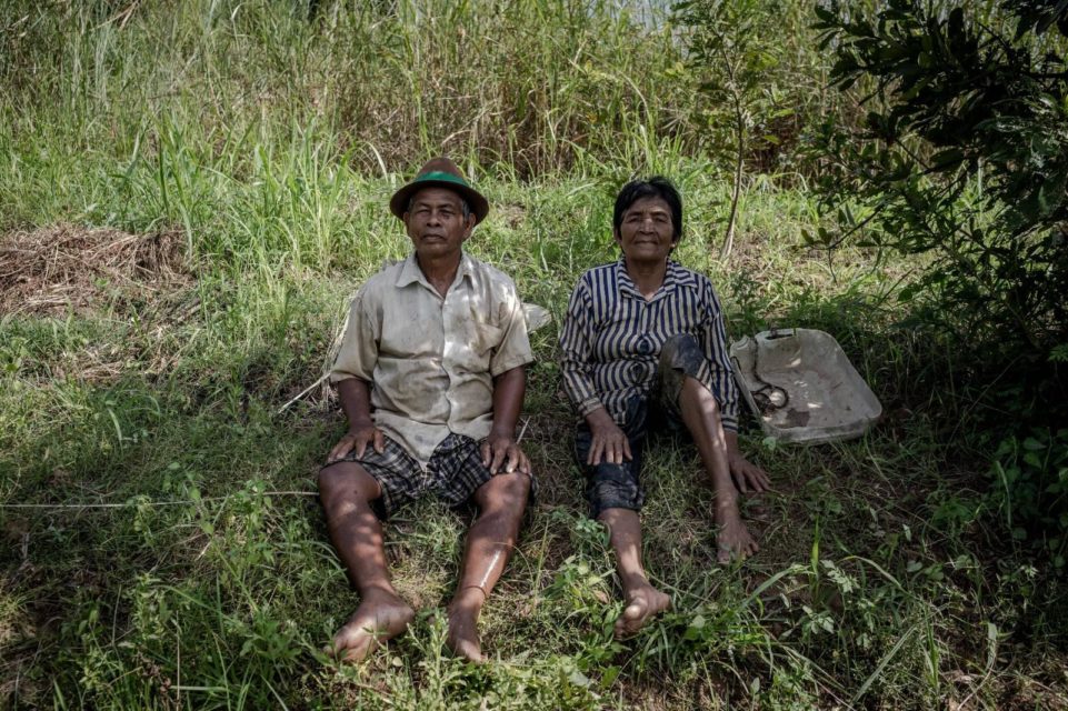 Kann Mann, 73, and Thuch Sorn, 71, in their fields in Kandal province’s Vihear Suor Cheung village on June 13 2022. (Roun Ry/VOD)
