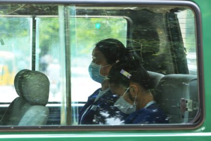 Two Thai women, Tongoon Worapha and Sornsin Ruthairat, in a van at the Supreme Court on August 10, 2022. (Hean Rangsey/VOD)