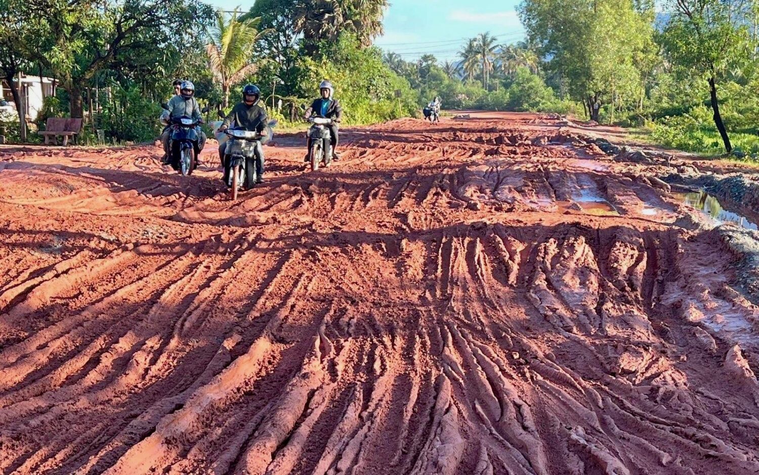 A supplied photo showing motorists using a wrecked section of National Road 3 between Kampot and Preah Sihanouk provinces last week.