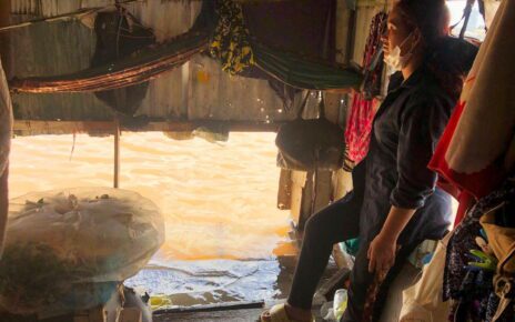 Nun Thea, 37, is hosting in her flooded home a family whose house has been completely submerged, in Phnom Penh’s Russei Keo district on October 6, 2022. (Ngay Nai/VOD)