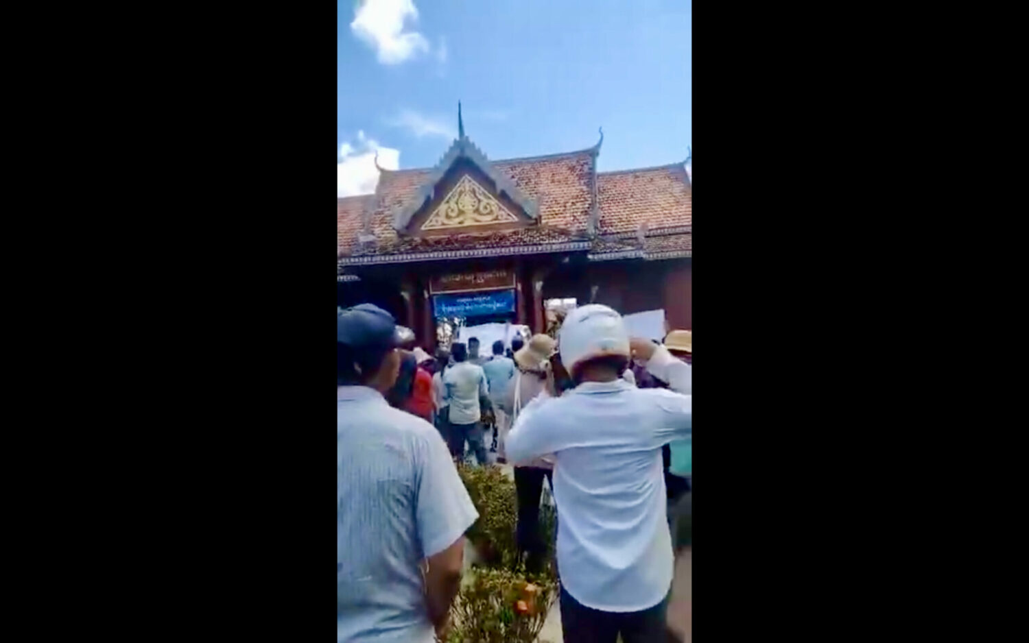 A screenshot from a supplied video showing residents gathered outside the Preah Dak commune hall on October 5, 2022.