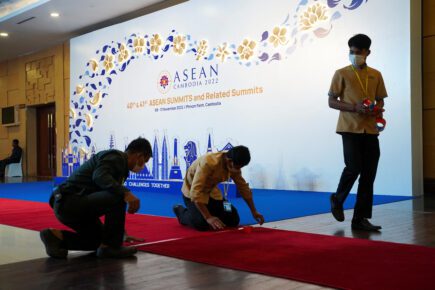 Workers fix a carpet inside the Sokha Hotel, the venue of the Asean Summit in Phnom Penh on November 9, 2022. (Cindy Liu/Reuters)