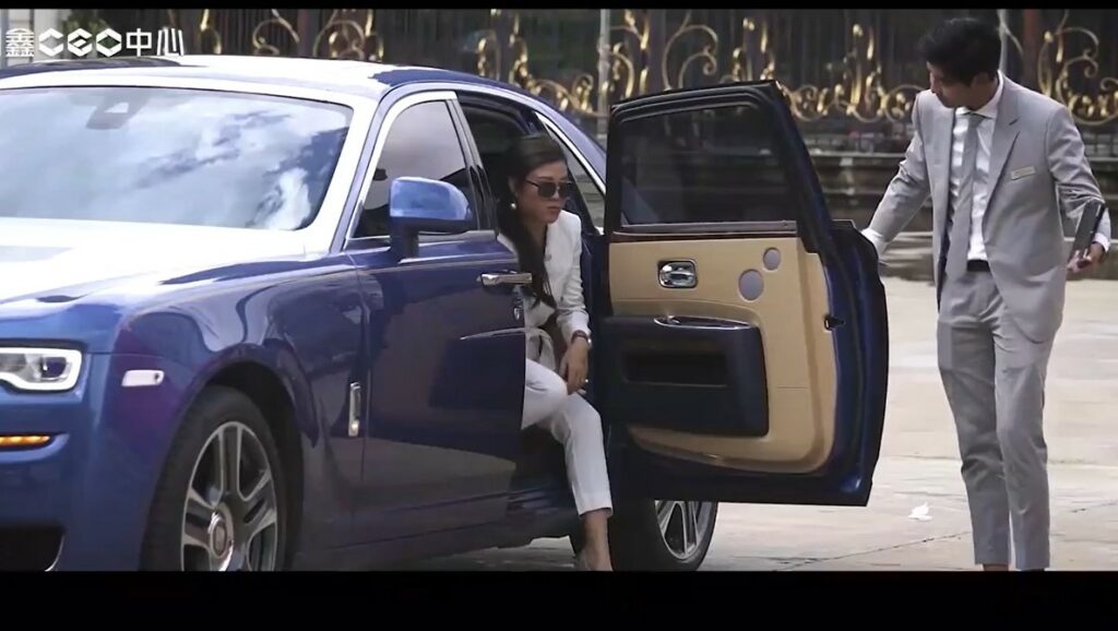 Pich Sreymom, of Pich Sunshine Realty KH, exits a Rolls Royce to enter a helicopter, in a screenshot from her "Day in the life as a CEO" promotional video, posted to her company Facebook page on October 21, 2020.