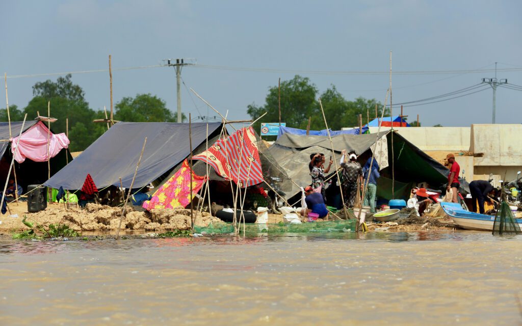 Residents living in makeshift tents to escape the flooded waters of the Prek Tnaut river on January 16, 2023. (Hean Rangsey)