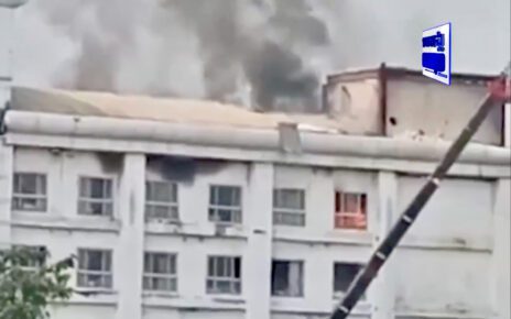 Fire can be seen in a window at the Grand Diamond City Casino on January 24, 2023. (Mekong News)