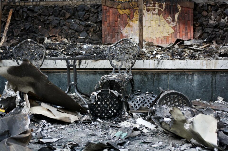 Chairs in the rubble of the burnt down Grand Diamond City Casino on December 31, 2022. (Michael Dickison/VOD)