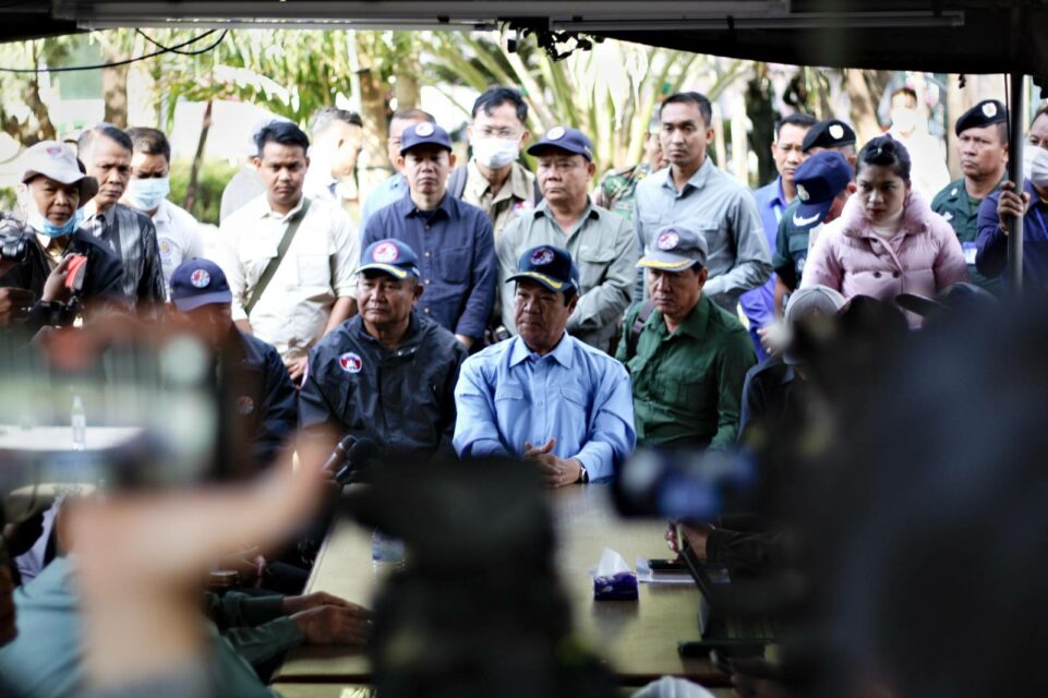 Officials speak to journalists about the burnt down Grand Diamond Casino in Poipet city on December 31, 2022. (Michael Dickison/VOD)