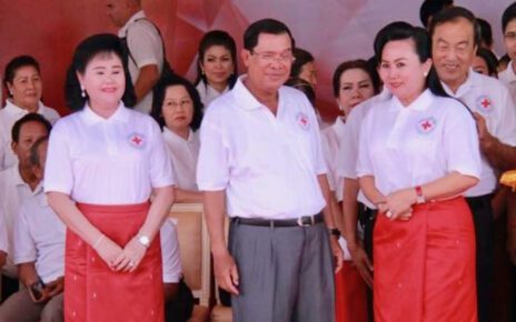 Seang Chanheng with Prime Minister Hun Sen and First Lady Bun Rany in a photograph posted to the okhna's Facebook page in 2018.
