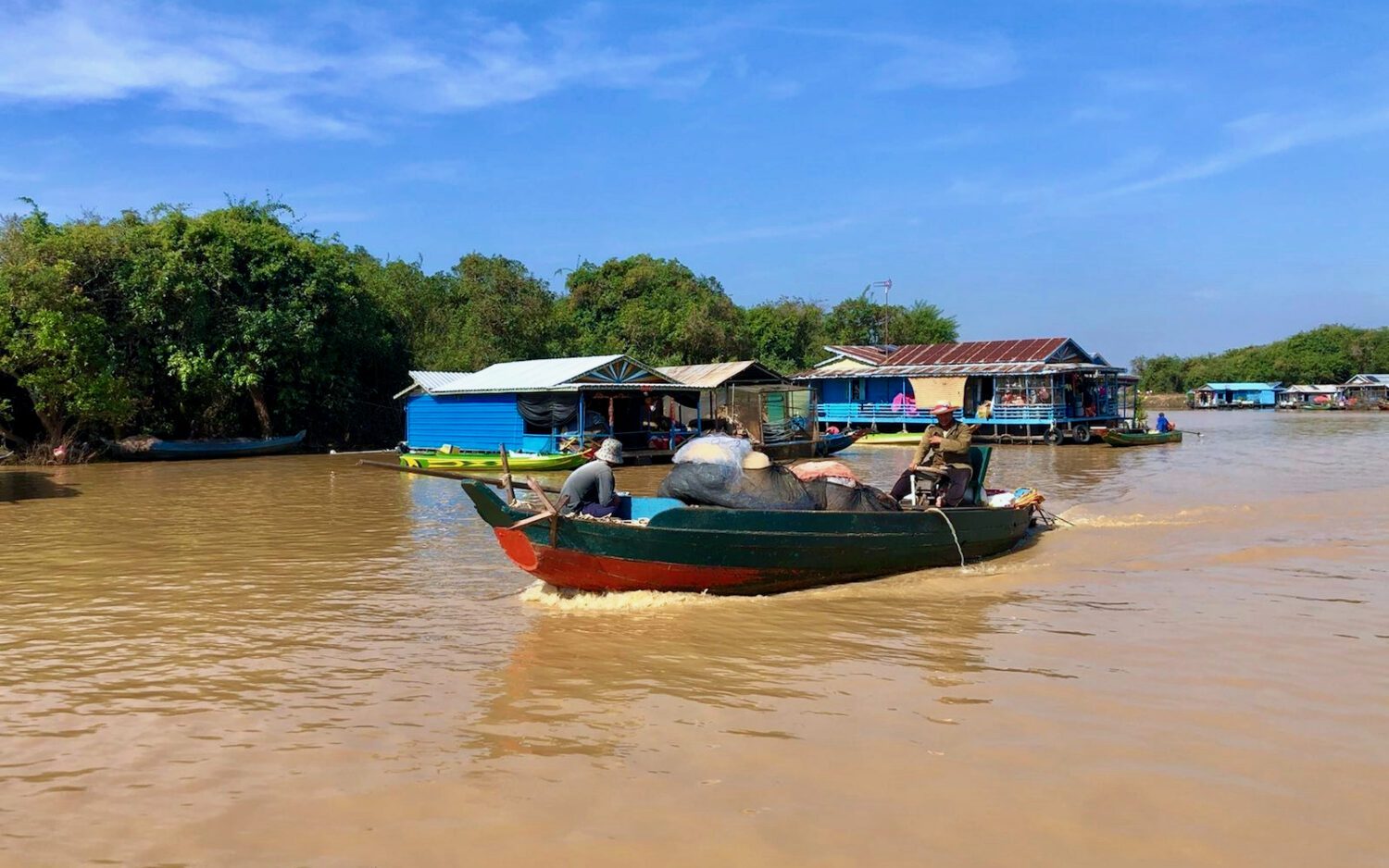 Fishers ride a boat in Siem Reap's Chong Khneas commune in mid-Janaury. (Fiona Kelliher/VOD)